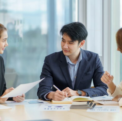 Asian business people planning analyze investment and marketing in office. Business meeting to brainstorm the new project and analysis data document.