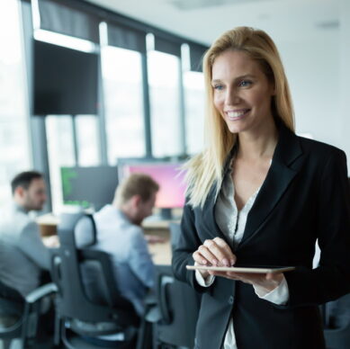 Businesswoman using tablet at information technology workplace