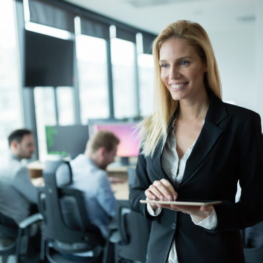 Businesswoman using tablet at information technology workplace