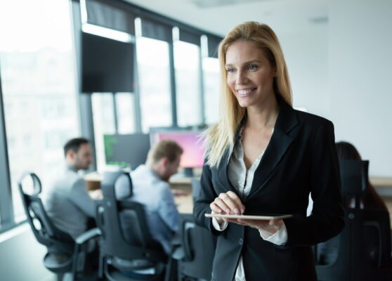 Businesswoman using tablet at information technology workplace